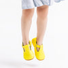 the original soft soled t-strap: neon yellow
