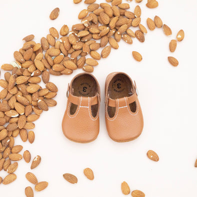 the original soft soled t-strap: almond