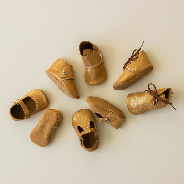 the original soft soled t-strap: gold shimmer