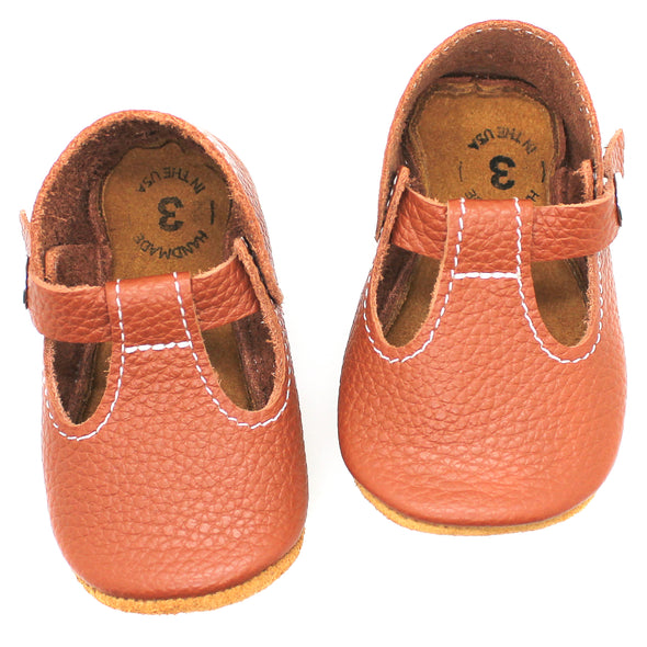 the original soft soled t-strap: cognac