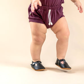 the original soft soled t-strap: black