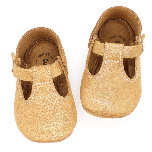 the original soft soled t-strap: gold shimmer