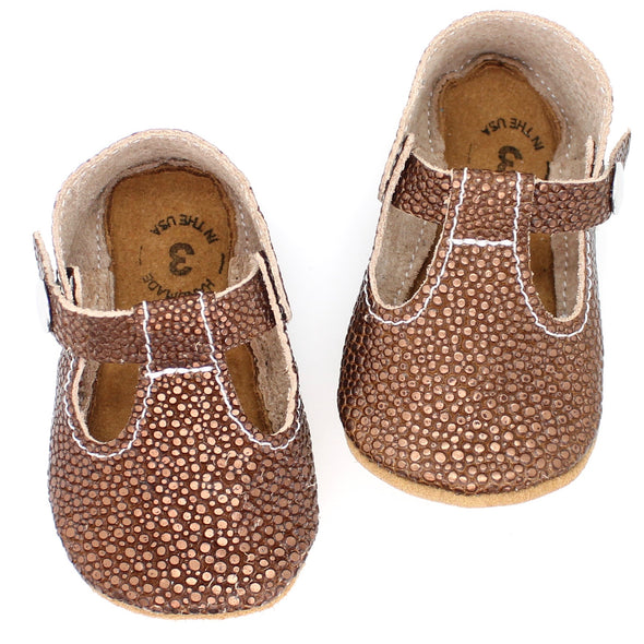 the original soft soled t-strap: stingray bronze